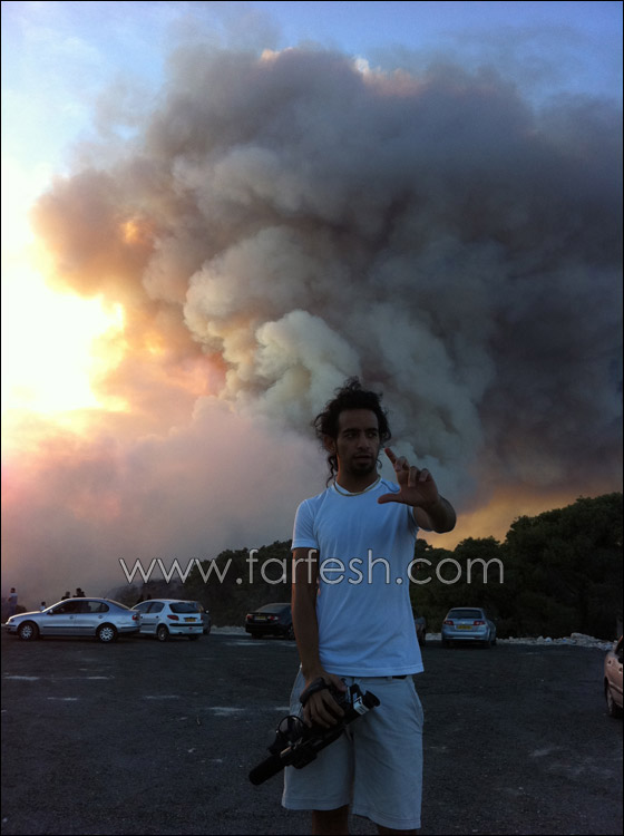 كارثة الكرمل تستقطب الناس لالتقاط صور تذكارية!  صورة رقم 12