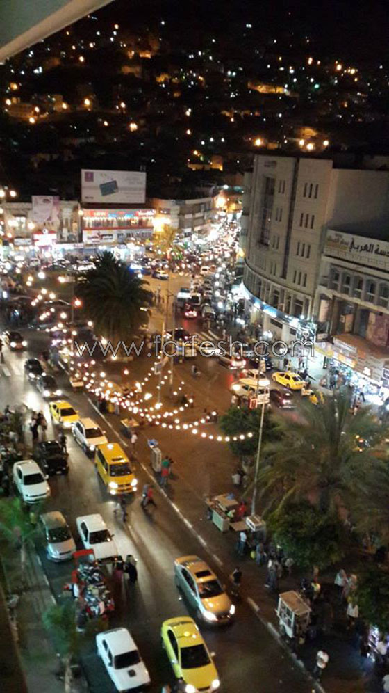 العاصمة الاقتصادية لفلسطين تعج بالأضواء وبهجة العيد  صورة رقم 12