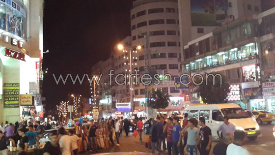 العاصمة الاقتصادية لفلسطين تعج بالأضواء وبهجة العيد  صورة رقم 18