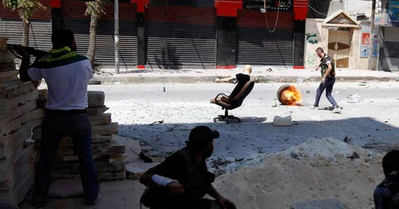 بالصور: المانيكان.. مقاتل غير شكل يدخل المعارك في سوريا! صورة رقم 11