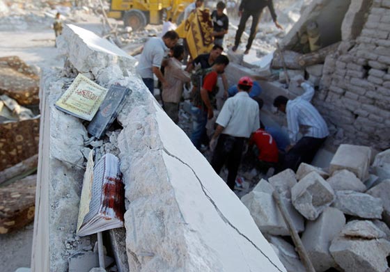 القرآن الكريم ملجأ للمقاتلين وشاهد على ويلات الحرب السورية صورة رقم 2