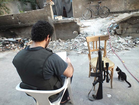 القرآن الكريم ملجأ للمقاتلين وشاهد على ويلات الحرب السورية صورة رقم 6