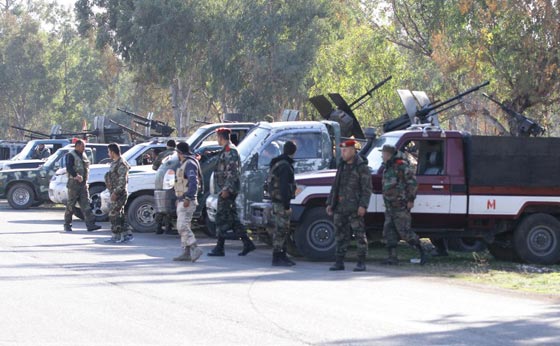 صور مئات المسلحين خلال اجلائهم من اخر احياء المعارضة في حمص صورة رقم 9