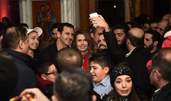 صور الاسد وعقيلته خلال زيارتهما لكنيسة خلال الاحتفال بالميلاد صورة رقم 6