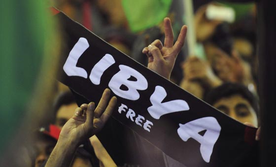 اكثر من صورة للقذافي.. في احداها يفر الى جهنم ويكشف عن وجهه الحاقد صورة رقم 4