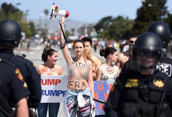  استقبال ترامب بالبيض والصدور المكشوفة وتهريبه من باب خلفي صورة رقم 2