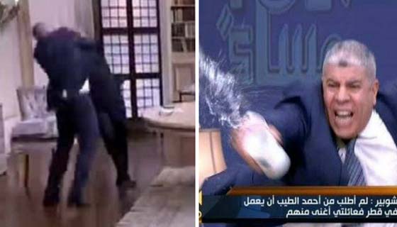 تراشق بالماء وضرب بالحذاء وتشابك بالايدي وعراك على الهواء صورة رقم 1