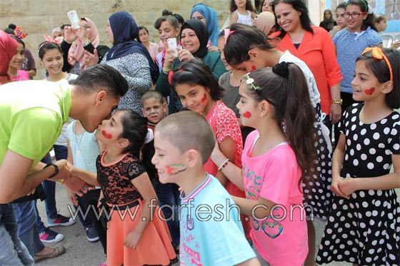 رمضان كريم..  محمد عساف  يتكفل بعشرين طفلا من قرية الايتام  صورة رقم 10