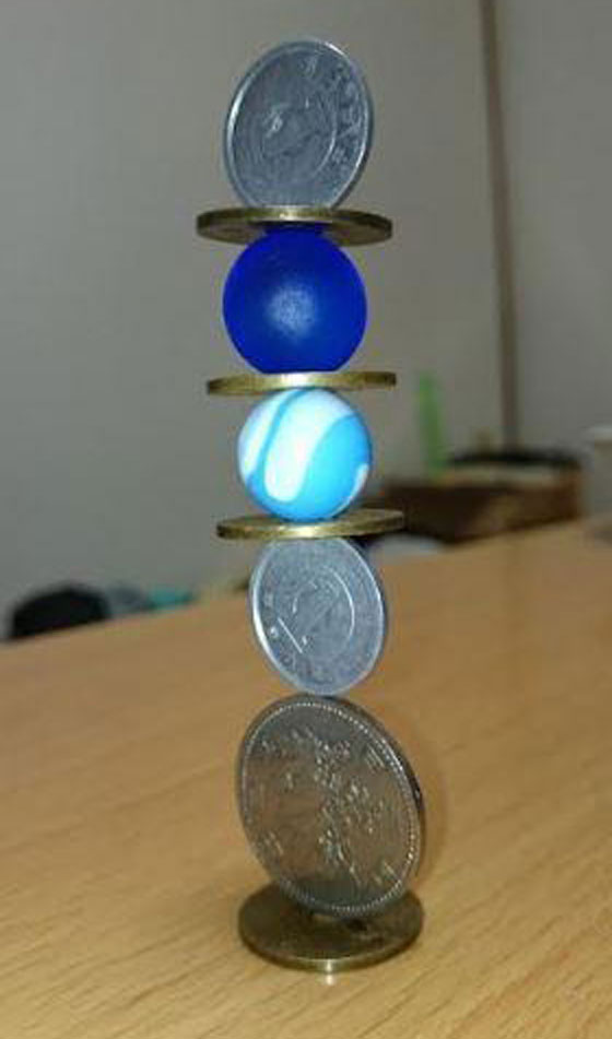 فيديو وصور.. فنان ياباني يتقن رص العملات بشكل معقد ومدهش! صورة رقم 13