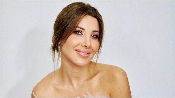 فيديو: معجب نانسي عجرم يهدد أيمن بهجت قمر، ونانسي تدافع عنه صورة رقم 1