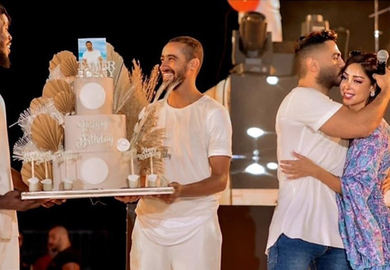 فيديو وصور: بسمة بوسيل تفاجئ زوجها تامر حسني بتورتة وعناق  على المسرح وتغني له صورة رقم 1