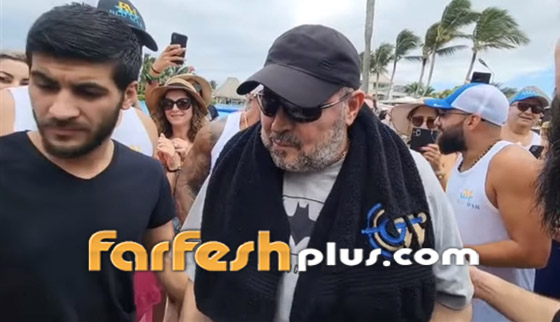صور وفيديو: جورج وسوف على الشاطئ جالسا على كرسي متحرك والجمهور حوله.. صورة رقم 5