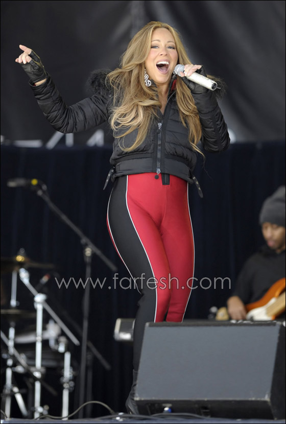 ماريا كاري ترتدي سروالا احمر ضيقا متباهية بقوامها الرشيق  صورة رقم 11