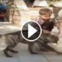 ضبع مفترس يخضع لارادة طفل صغير وينسحب من الساحة!!